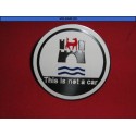 EMBLEMA PLACA REDONDA "THIS IS NOT A CAR"